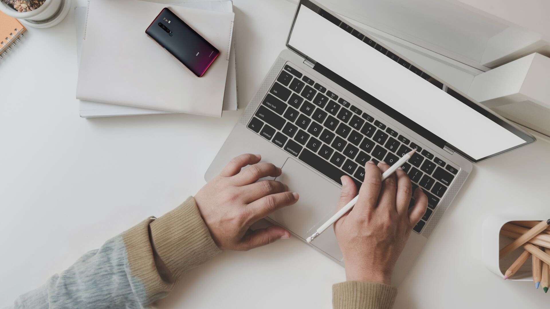 A person typing on a laptop